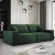 Butelkowozielona sofa do salonu sztruksowa CORTINA z poduszkami aranżacja