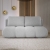 Jasnoszara sofa do salonu pikowana boucle MISTY front aranżacja
